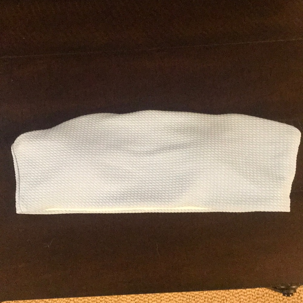 Swimsuit top size small, never worn. Light blue